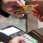 Close-up of a credit card payment being processed at a POS terminal.
