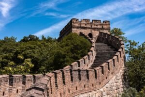 part of the great wall of china with stairs to the watchtower on the hill