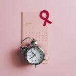 close up shot of a pink ribbon on a calendar