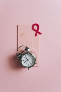 close up shot of a pink ribbon on a calendar